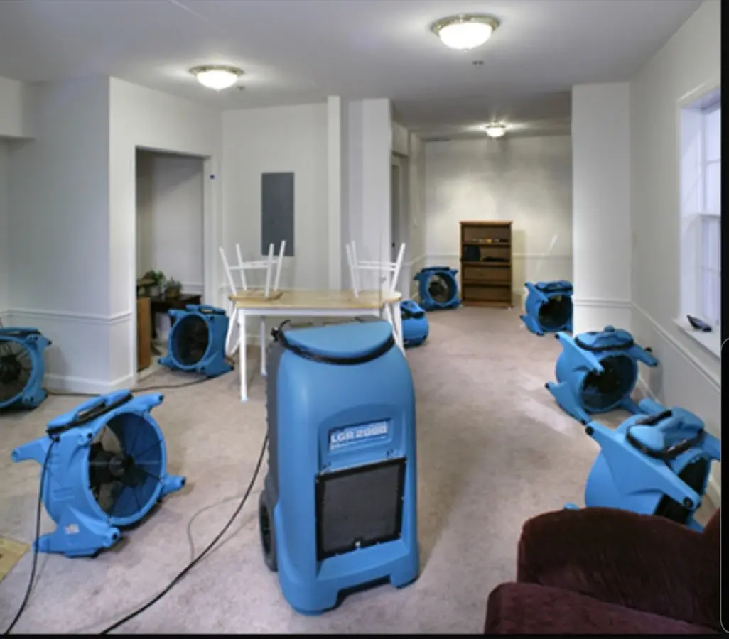 Air movers and dehumidifier setup for Water Damage Restoration in Derry